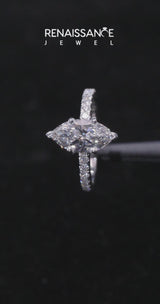Silver Marquise Cut Diamond Solitaire Ring with Pavé Accents and Four-Prong Setting