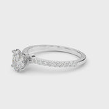 Silver Oval Cut Diamond Solitaire Ring with Pavé Accents and Four-Prong Setting