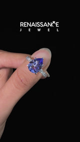 Silver Pear Cut Tanzanite Side Stone Solitaire Ring with Round and Four-Prong Setting