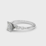 Silver Emerald Cut Diamond Solitaire Ring with Side Stones and Four-Prong Setting