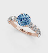 Rose gold Fancy Blue Round Cut Diamond Prong Setting with Side Stones on a Pave Band