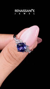 Silver Cushion Cut Tanzanite Ring with Side Stones and Four-Prong Setting