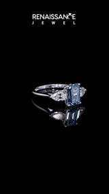 Silver Three-Stone Fancy Blue Emerald Cut Diamond Ring with Pear  Side Stones in Four-Prong Setting