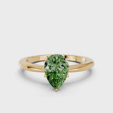 Yellow gold Fancy Green Pear Cut Diamond Solitaire Ring with Six-Prong Setting and Classic Band