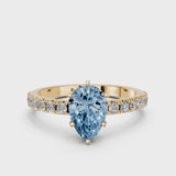 Yellow gold Fancy Blue Pear Cut Diamond Solitaire Pavé Band with Four-Prong Setting