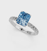 White gold Fancy Blue Radiant Cut Diamond Solitaire Pavé Band with Four-Prong Setting