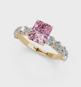 Yellow gold Fancy Pink Radiant Cut Diamond Prong Setting with Side Stones on a Pave Band