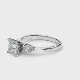 White gold Three-Stone Princess Cut Diamond Ring with Pear Side Stones and Four-Prong Setting