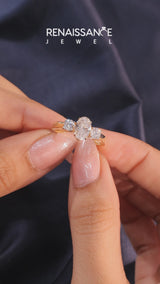 Yellow gold Three-Stone Oval Diamond Ring with Round Side Stones, Classic Band, and Four-Prong Setting