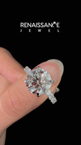 White gold Round Cut Diamond Solitaire Ring with Shared Prong Pavé Band and Four-Prong Setting
