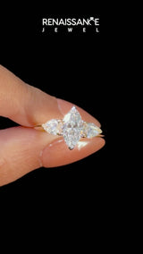 Yellow gold Three-Stone Marquise Cut Diamond Ring with Pear Side Stones and Four-Prong Setting