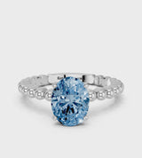 White gold Fancy Blue Oval Cut Diamond Solitaire Ring with Beaded Band and Prong Setting