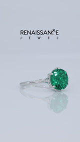 Silver Round Cut Emerald Solitaire Ring with Flower Prong Setting and Classic Band