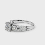 White gold Cushion Cut Diamond Three-Stone Ring with Pavé Split Shank and Four-Prong Setting
