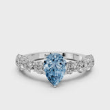 Silver Fancy Blue Pear Cut Diamond Prong Setting with Side Stones on a Pave Band