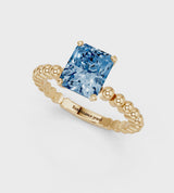 Yellow gold Fancy Blue Radiant Cut Diamond Solitaire Ring with Beaded Band and Prong Setting