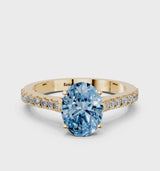 Yellow gold Fancy Blue Oval  Cut Solitaire Diamond Engagement Ring with Pave Band and Four-Prong Setting