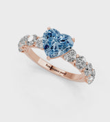 Rose gold Fancy Blue Heart Cut Diamond Prong Setting with Side Stones on a Pave Band
