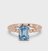 Rose gold Fancy Blue Emerald Cut Diamond Solitaire Ring with Beaded Band and Prong Setting