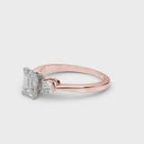 Rose gold Three-Stone Emerald Solitaire Ring with Tapered Band and Four-Prong Setting