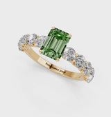 Yellow gold Fancy Green Emerald Cut Diamond Prong Setting with Side Stones on a Pave Band