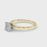 Yellow gold Cushion Solitaire Diamond Engagement Ring with Four-Prong Setting on a Classic Band