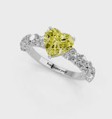 White gold Fancy Yellow Heart Cut Diamond Prong Setting with Side Stones on a Pave Band
