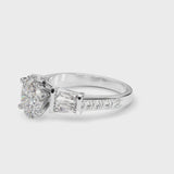 Platinum Oval Cut Diamond Engagement Ring with Baguette Side Stones and Channel Set Band