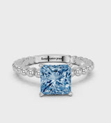 Platinum Fancy Blue Princess Cut Diamond Solitaire Ring with Beaded Band and Prong Setting