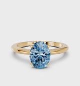 Yellow gold Fancy Blue Oval Cut Diamond Solitaire Ring with Six-Prong Setting and Classic Band
