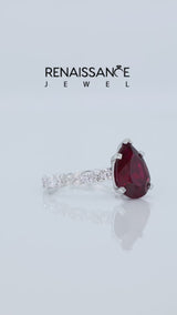 Silver Pear Cut Ruby Side Stone Solitaire Ring with Round and Four-Prong Setting