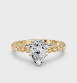 Yellow gold Pear Cut Diamond Solitaire Ring with Beaded Band and Prong Setting