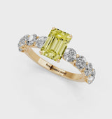 Yellow gold Fancy Yellow Emerald Cut Diamond Prong Setting with Side Stones on a Pave Band