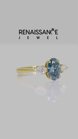 Yellow gold Fancy Blue Oval Cut Diamond Three-Stone Ring with Pear Side Stones and Prong Setting