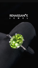 Silver Oval Cut Peridot Solitaire Engagement Ring with Classic Band and Four-Prong Setting
