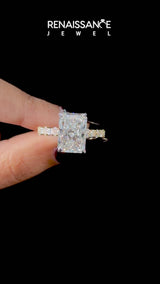 Yellow gold Radiant Cut Diamond Side Stone Solitaire Ring with Round  and Four-Prong Setting