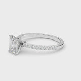 Silver Emerald Cut Diamond Solitaire Ring with Pavé Accents and Four-Prong Setting