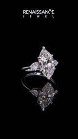 Silver Three-Stone Marquise Cut Diamond Ring with Pear Side Stones and Four-Prong Setting