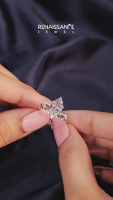 Platinum Marquise Cut Diamond Solitaire Ring with Twisted Band and Pavé Accents