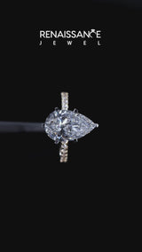 Yellow gold Pear Cut Diamond Solitaire Ring with Pavé Accents and Four-Prong Setting
