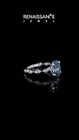 White gold Fancy Blue Oval Cut Diamond Ring with Marquise Side Stones and Prong Setting