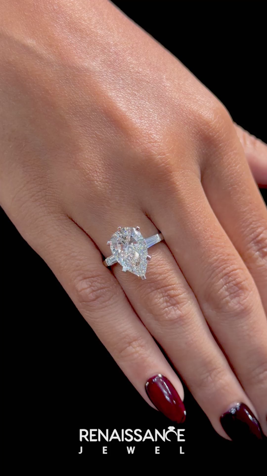 White gold Pear Solitaire with Tapered Baguette Side Stones on a Classic Band with Six-Prong Setting_30