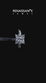 Platinum Princess Cut Diamond Solitaire Ring with Tapered Baguette Accents and Four-Prong Setting