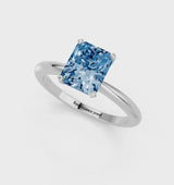 White gold Fancy Blue Radiant Cut Diamond Solitaire Ring with Six-Prong Setting and Classic Band