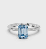 Silver Fancy Blue Emerald Cut Diamond Solitaire Ring with Six-Prong Setting and Classic Band