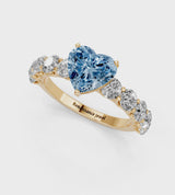 Yellow gold Fancy Blue Heart Cut Diamond Prong Setting with Side Stones on a Pave Band