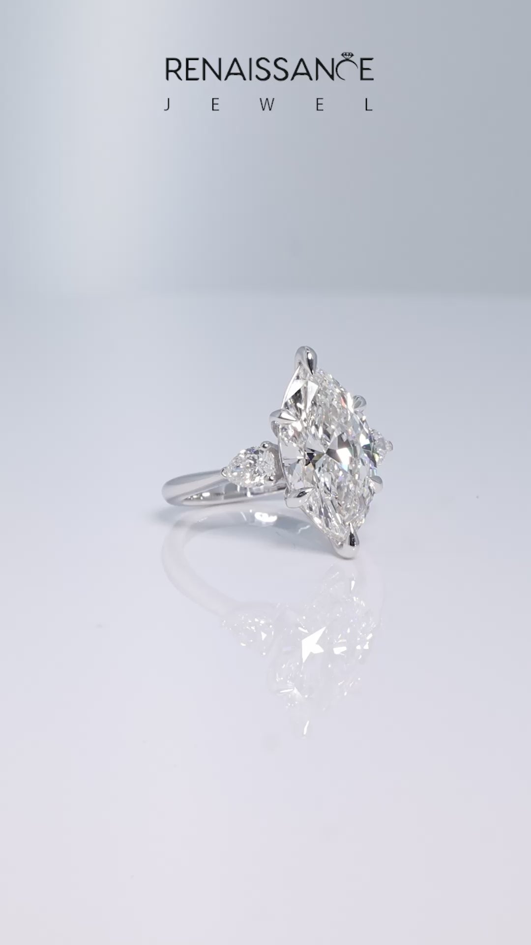 Platinum Three-Stone Marquise Diamond Ring with Pear Side Stones in Four-Prong Setting_23
