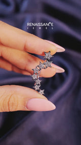 Silver Star Cluster Diamond Crescent Earrings with Round Cut Stones on a Curved Band and Prong Setting
