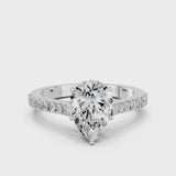 Silver Pear Cut Solitaire Diamond Engagement Ring with Pave Band and Four-Prong Setting