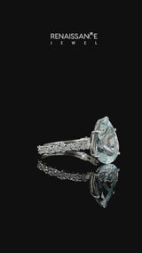 Silver Pear Cut Aquamarine Side Stone Solitaire Ring with Round  and Four-Prong Setting